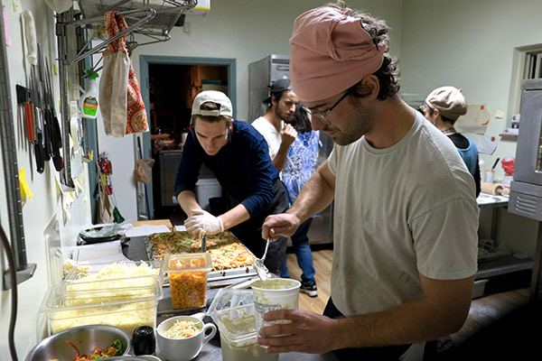 people making pizza